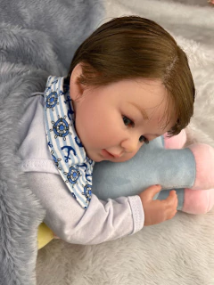 Bebê Reborn Menino Corpo de Pano Cabelinho Fio a Fio Enxoval Príncipe na internet