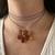 Collar Glimmer chocolate - La Oveja Negra