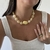 Colar Pedras Orgânicas Off White/Dourado - loja online