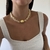 Colar Pedras Bicos Triplo Off White/Dourado - comprar online