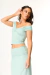 Top ombro a ombro com detalhe torcido no busto