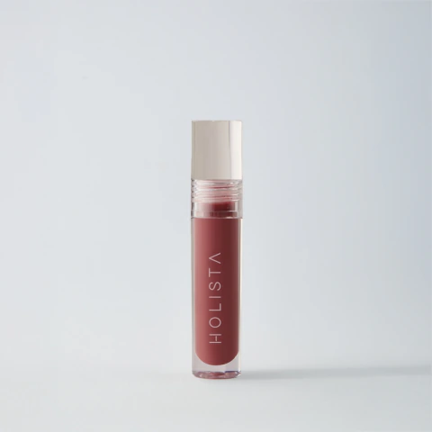 Bálsamo labial Glossy Balm Plumberry de Holista en envase transparente con tapa clara, ideal para cuidado y color de labios.