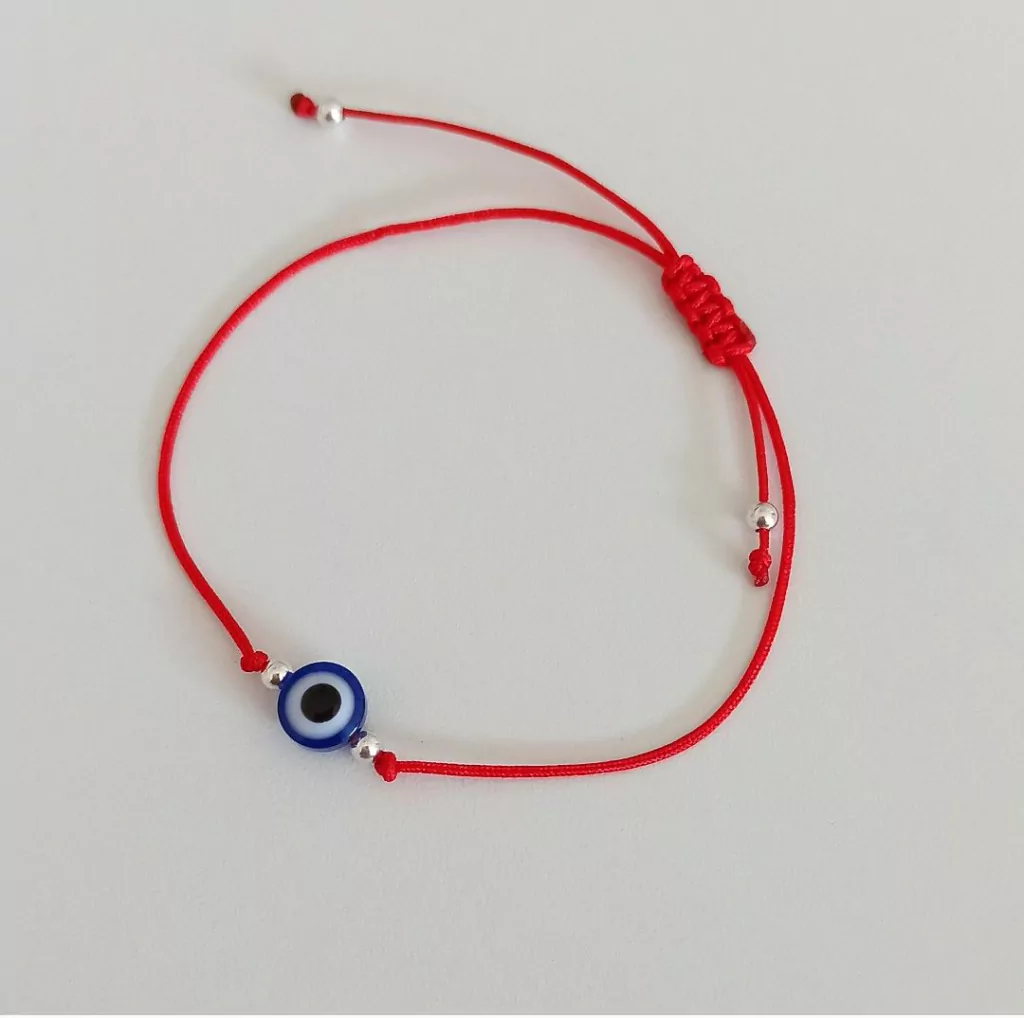 Pulsera red ajustable con bolitas de plata y ojo turco