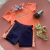 Conjunto You Blusa Recortes Laranja Neon Short Pink BichoBagunça