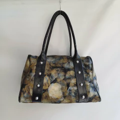 BOLSO DE MANO TACHAS DANIEL VALDEZ