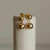 Brinco Esfera Dupla Pendurada em Banho Ouro 18K - comprar online