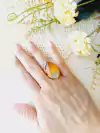 ANEL OVAL COM PEDRA NATURAL AGATHA VERMELHA