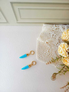 BRINCO ARGOLA PINGENTE REMOVÍVEL DENTE DE SABRE HOWLITA TURQUESA - comprar online