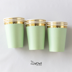 vasos verdes con ondas doradas
