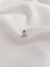 Piercing triângulo cravejado na internet