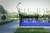 Vista de una cancha de padel Classic de PADELAR con césped sintético azul y estructura metálica.