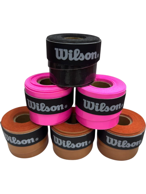 Cubre grip Wilson Comfort liso en varios colores, ideal para raquetas de tenis o pádel, apilados en pirámide.