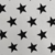 Gabardina estrellas negras fondo blanco