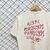 Camiseta Chronic “Anti R R Club” Bege na internet