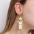 Brinco Sylvinho Amarelo - loja online