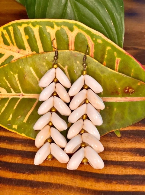 Max brinco escama de búzios