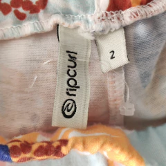 LEGGING - RIPCURL - TALLE 2 AÑOS - BLANCO MOTIVO FLORES ROSAS AMARILLO Y CELESTE - PilchaGo