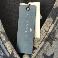 Imagen de SAQUITO - KOSIUKO - TALLE M - NEGRO Y DORADO MOTIVO ESTRELLAS