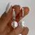 Aros argolla acero blanco con dijes redondos perlas