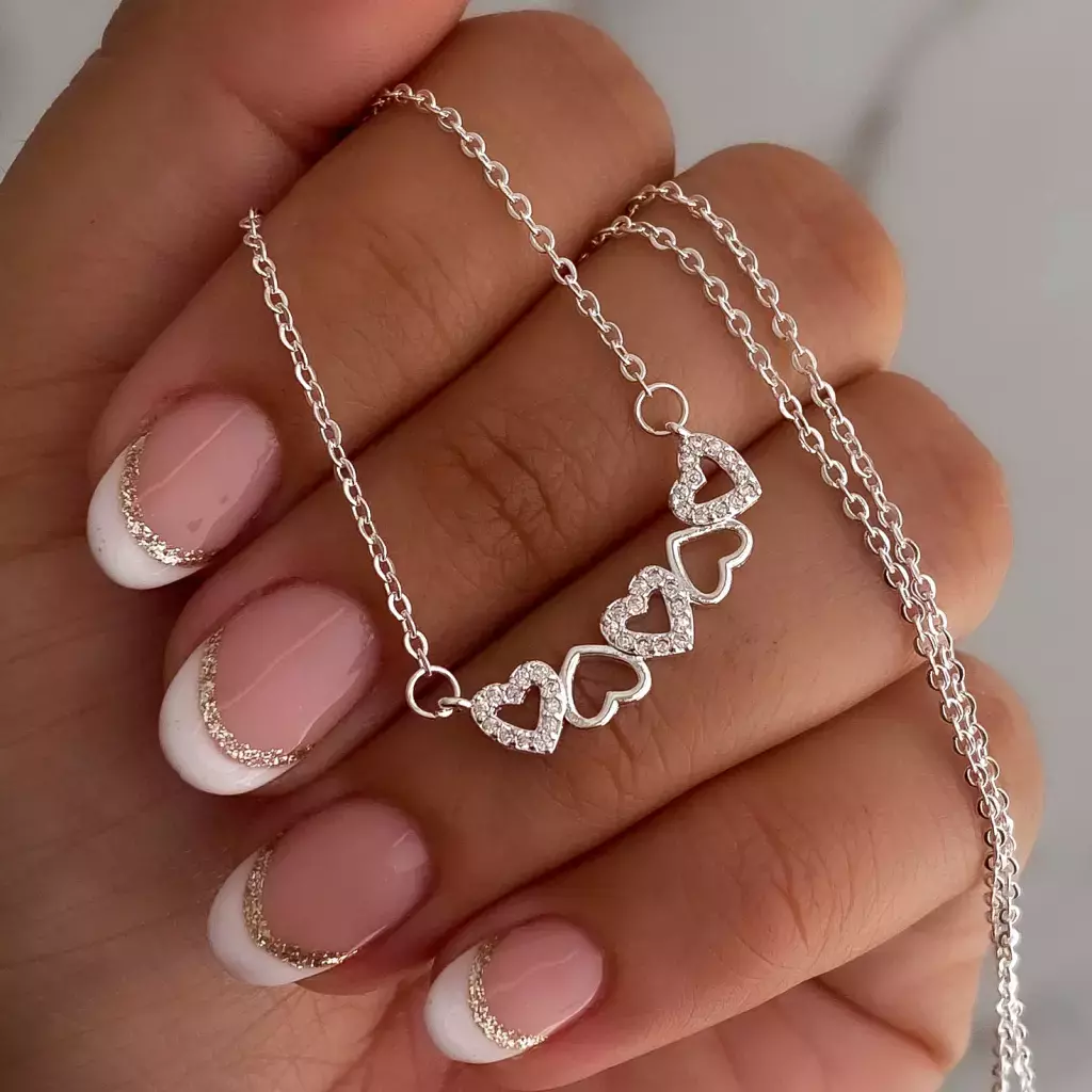 Conjunto acero blanco cinco corazones 45-50 cm