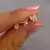 Set de aros bañados en oro moñitos - comprar online