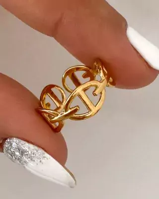Anillo acero dorado eslabón G