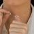 Choker 9 Olhos Gregos Branco de Prata mista na internet