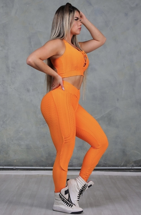 Legging modeladora laranja neon