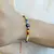 PULSERA DE HILO CON CRISTALES Y OJO TURCO en internet