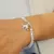 PULSERA ELASTIZADA DE CRSITAL DE ROCA CON DIJE
