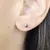 PASANTE MINI CIRCULO LABRADO CON PIEDRA RUBI