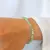 PULSERA ELASTIZADA DE CRISTALES DE ROCA BICONO (GAMA COLORES CELESTES/VERDES) - tienda online