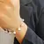 PULSERA CON DIJES