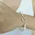 PULSERA CON PERLAS DE RIO Y ROMBOS RAYADOS - comprar online