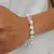 PULSERA CON PERLAS Y SW
