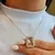 CONJUNTO CADENA CON DIJE CUBIC RECTANGULAR CON MICROPAVE Y ARO PASANTE CUBIC Y MICROPAVE - comprar online