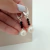COLGANTE CON CRISTALES SW. NEGRO Y PERLA