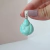 DIJE DE BUDA EN RESINA VERDE AGUA