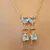 CADENA CON DIJE DOS NENES CON CUBIC CELESTE - comprar online