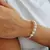 PULSERA DE HILO Y PERLAS - EUFROSINA JOYAS