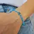 PULSERA ELASTIZADA CRISTAL BICONOS Y OJO TURCO - comprar online