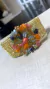 Bracelete em crochê fio metal ouro 3cm largura, medalha flor central collor 4cm x 4cm, cristais e vidrilhos tchecos 6 cores, fecho magnético, 17cm.