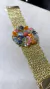 Bracelete em crochê fio metal ouro 3cm largura, medalha flor central collor 4cm x 4cm, cristais e vidrilhos tchecos 6 cores, fecho magnético, 17cm. na internet