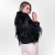 Pellicious coat jacket in smooth natural Tibetan goat fur and goat pelica leather with exclusive design featuring high collar and pocket, feminine woman by Fabiane Frank Fur and Shop, cozy for the autumn-winter cold of 2024-2025. Back black.
