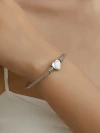 Pulseira bracelete para berloques em aço inox coração passante - COD. A396 - comprar online