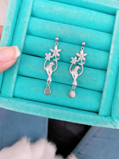 Brincos em aço inox pássaro com flores - COD. HA66B na internet