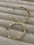Cod 431 Argola tamanho medio, trançada , folheados a ouro 18k - comprar online