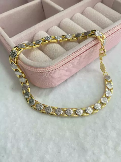 668 pulseira unissex,toda trabalhada com duas cores folheada a prata. 