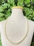 Cod; 606. colar em perolas, folheados a ouro 18k.