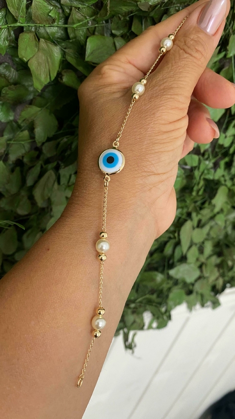 Cod 1295; Pulseira 20cm Com pingentes , olho grego, perolas e bolinhas.